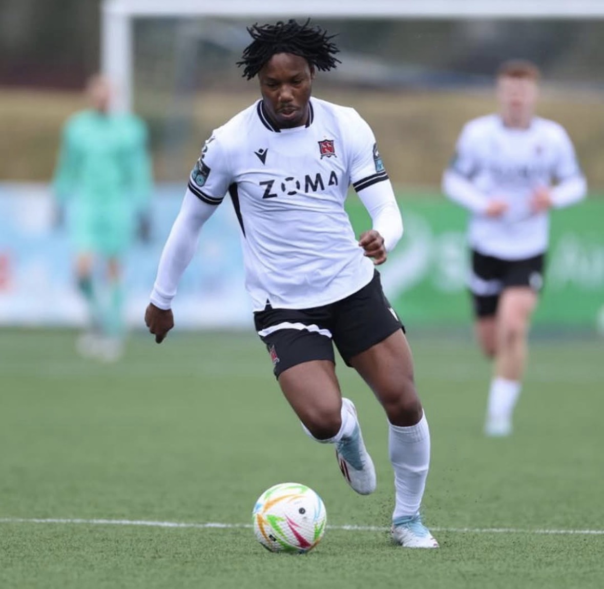 31554717-FF51-443A-9FB9-21D3FB1C71E6_L0_001-24_01_2026, 20_25_36 Two young footballers looking for the ball in the air tugging at each others shirts trying for the ball